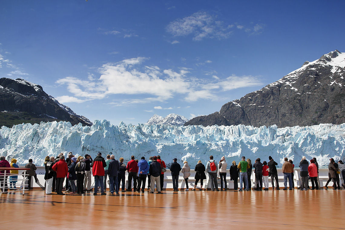 Cruise passengers watching a glacier in Alaska