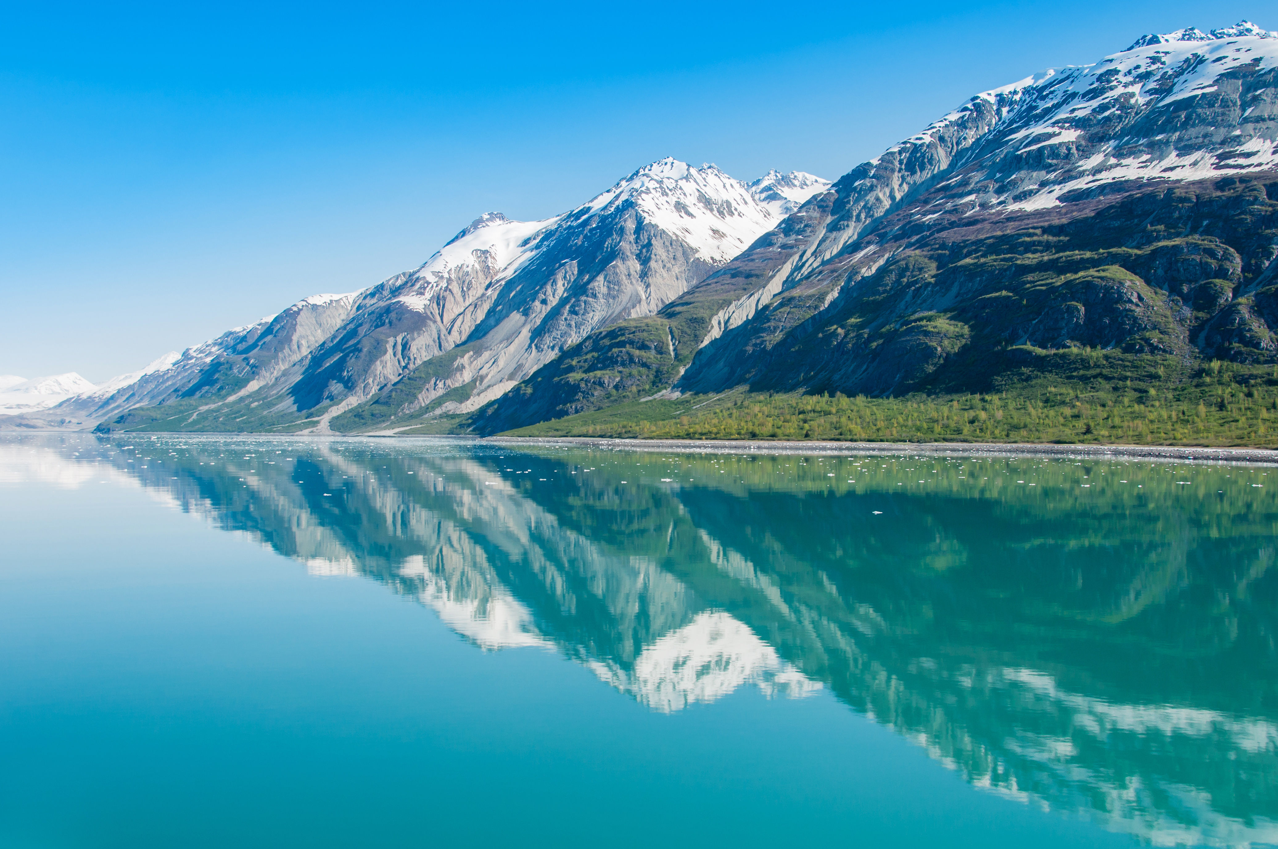 Mountains reflecting in still water, Glacier Bay National Park, Alaska