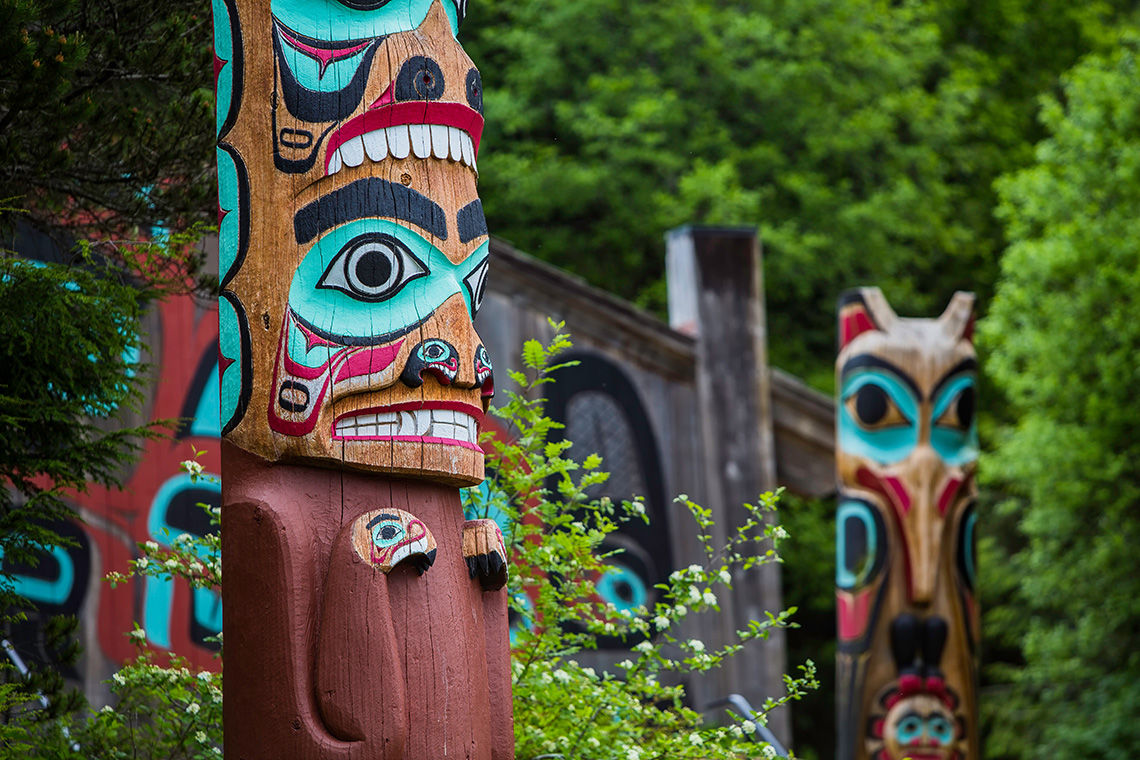 Totem Poles Near Saxman Tribal House