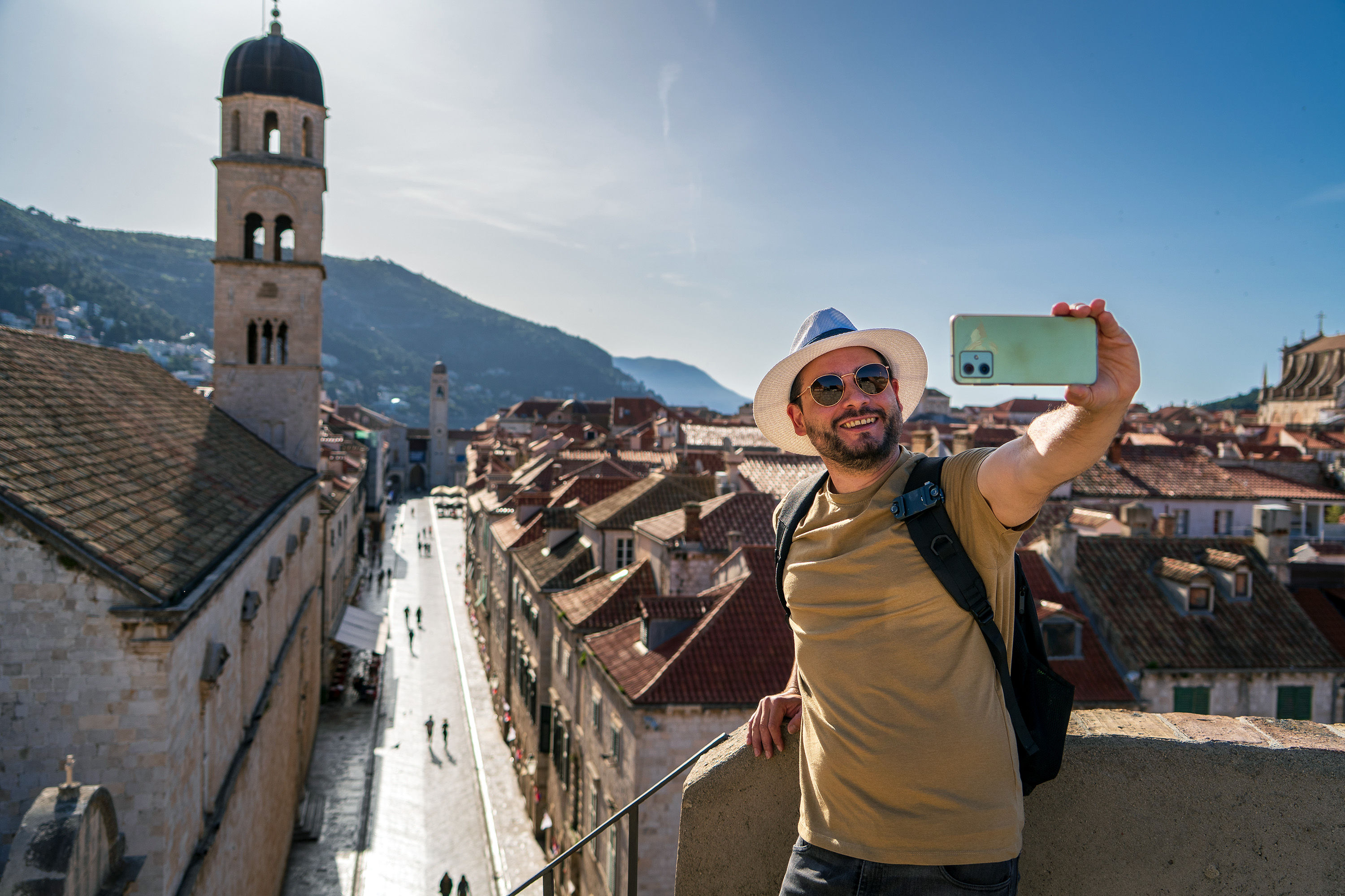 Tourist taking selfie on the city walls in Dubrovnik
