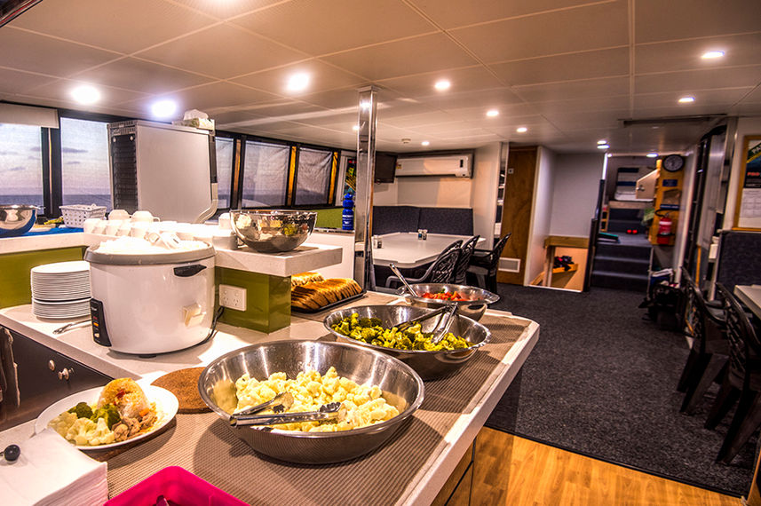 Breakfast in the dining area onboard ScubaPro II