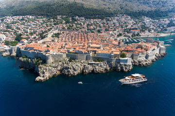 Small cruise ship passing by Dubrovnik, Croatia
