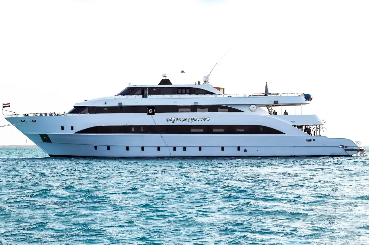 Captain Sparrow at anchor, with her name visible on the white hull
